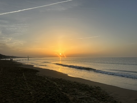 Sunrise over the sea at Bournemouth beach.