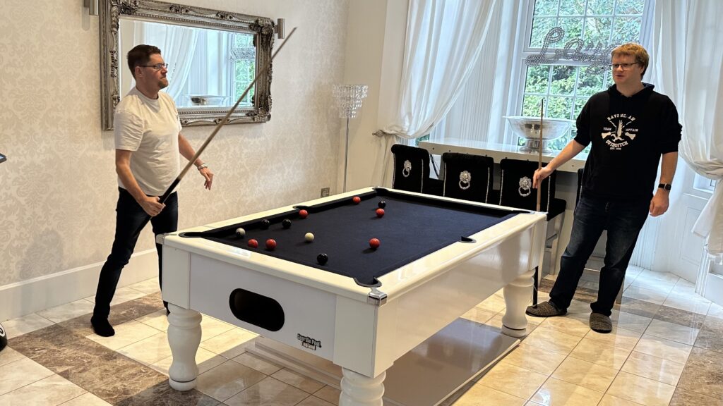 John and Ben enjoy a game of pool during our downtime